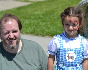 Matt Heffernan brought his daughter, 3-year-old Elodie, from Canastota to watch Saturday's Oz-Stravaganza parade. Photo by Brian McDowell