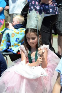 Lili Bernard, 7, from Chittenango, dressed as Glinda to watch the parade during Sartuday's Oz-Stravaganza. Photo by Brian McDowell