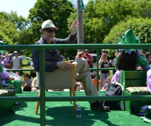 Gregory Maguire, who wore the novel "Wicked," waved to paradegoers from the Oneida Nation float during Saturdays Oz-Stravaganza parade in Chittenango. Photo by Brian McDowell