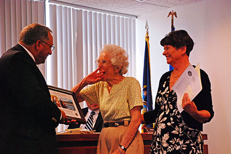 Chairman John Becker presented Cazenovia resident Pat Crosby with a certificate of recognition for her years of support in promoting recycling in Madison County. Recycling Coordinator Sharon Driscoll, right, presented Crosby with a gift certificate to the Brewster Inn.