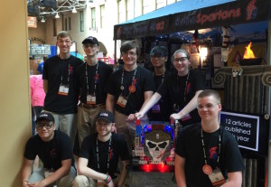 Front L-R:  Timothy Ha, Ryan Payne, Laconicus (the team’s robot) & Douglas Hotvedt. Back L-R: Oscar Klempay, Matthew Strachen, Daniel Michaels, Kevin Valete & Gwyneth LaMarche