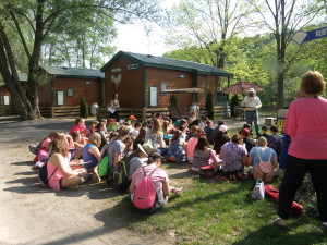 Jake Schieferstine gives a demonstration to the youth on Bee Keeping.