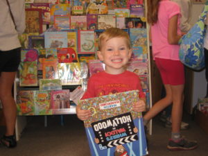 Cameron Norris is thrilled with his book sale purchase
