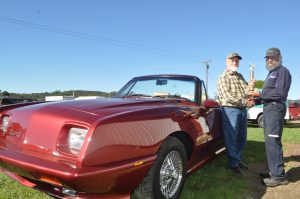 Just Cruise-In Best of Show (1989 Avanti Convertible owned by Tom Bailey of New Hartford, Ray McClain is presenting the trophy).