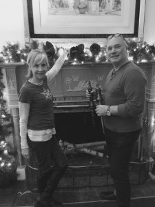 In preparation for “Christmas at Lorenzo” in Cazenovia, Mary Schalk, of Mary Schalk Design, and Jeffrey Mayer, Associate Professor of Fashion Design at Syracuse University, install and arrange their interpretation of “Dreaming of a White Christmas” in the Study.