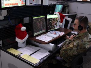Airman 1st Class Kyle Larsen, a member of the New York Air National Guard assigned to the Eastern Air Defense Sector in Rome, keeps an eye on the sky over the eastern U.S. while preparing for Christmas Eve, when the sector's Airmen will help in the annual NORAD Tracks Santa effort to get St. Nick to his destinations safely. (U.S. Air Force Photo by Patrick Young)